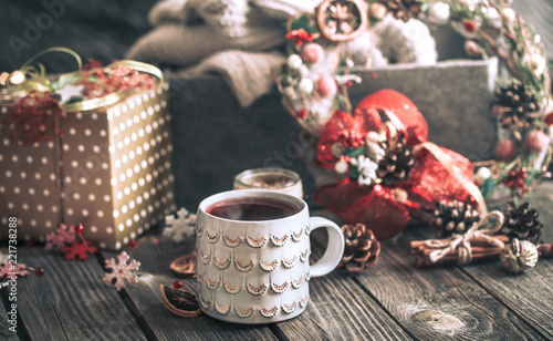 mulled wine in a cup on a wooden background