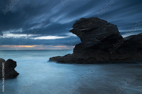 Llangrannog beach long exposure at sunset with blurry clouds