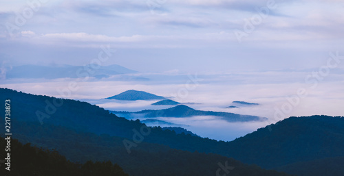 Fog settles between mountains in Shenandoah National Park, VA on a foggy morning. © Tyler Rickenbach