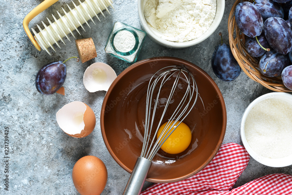 Ingredients for baking. The process of preparing shortcakes. Plum pie. Ingredients for baking. The process of preparing shortcakes. Plum pie.