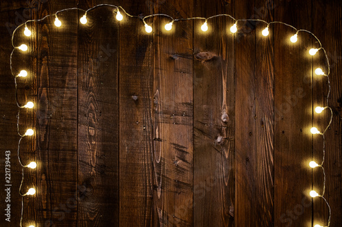 light bulbs on wooden background photo