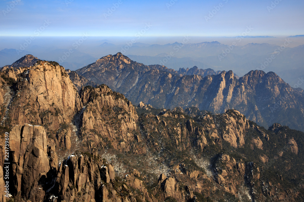 Obraz premium Huangshan China National Park - Anhui Province, Chinese Mountain Peak. Sea of Fog, Yellow Granite Mountains with Canyon, Exotic Pine Trees and Forest, Jagged Cliffs, UNESCO World Heritage Site