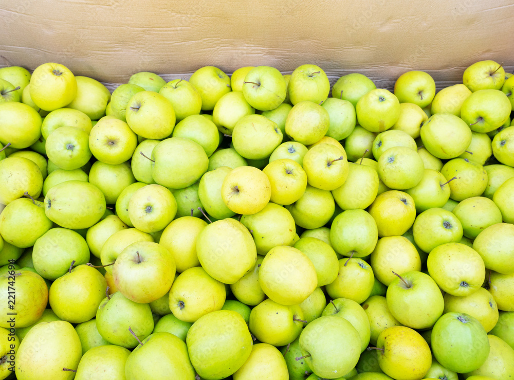 green apples background in wooden box at street market green apples background in wooden box at street market