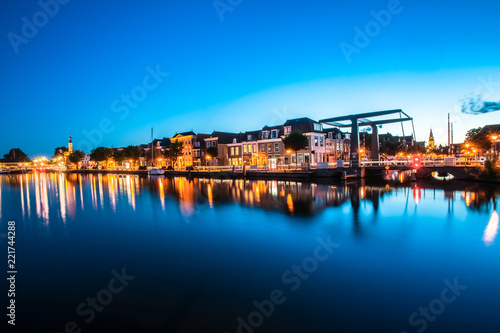 The old harbor with the beer quay and its 'accijnstoren' (Tax Tower) in Alkmaar. Made at sunset , bleu hour © fotografiecor