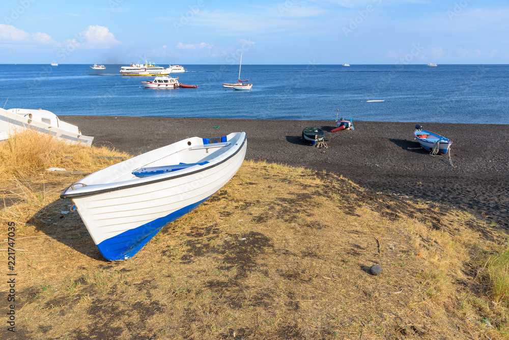 Boat on the black beach on Stromboli Island Boat on the black beach on Stromboli Island