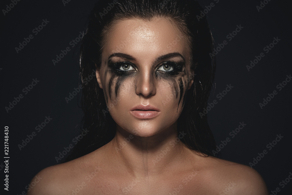 Sad and beautiful woman with smudged makeup on her face Stock Photo | Adobe  Stock