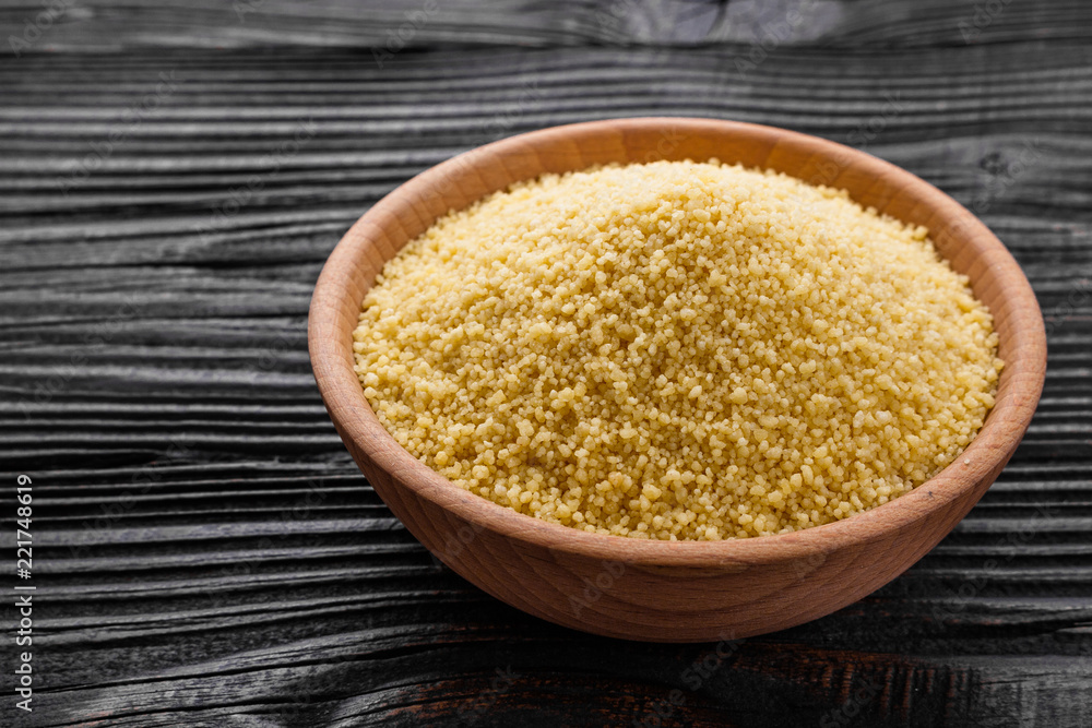 fresh couscous on a wooden rustic background fresh couscous on a wooden rustic background