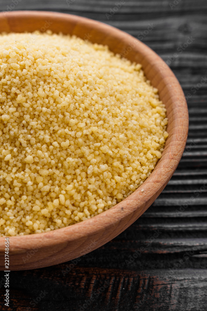 fresh couscous on a wooden rustic background fresh couscous on a wooden rustic background