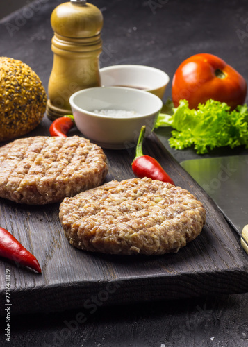 raw minced meat on cutting board, ingredients for burger