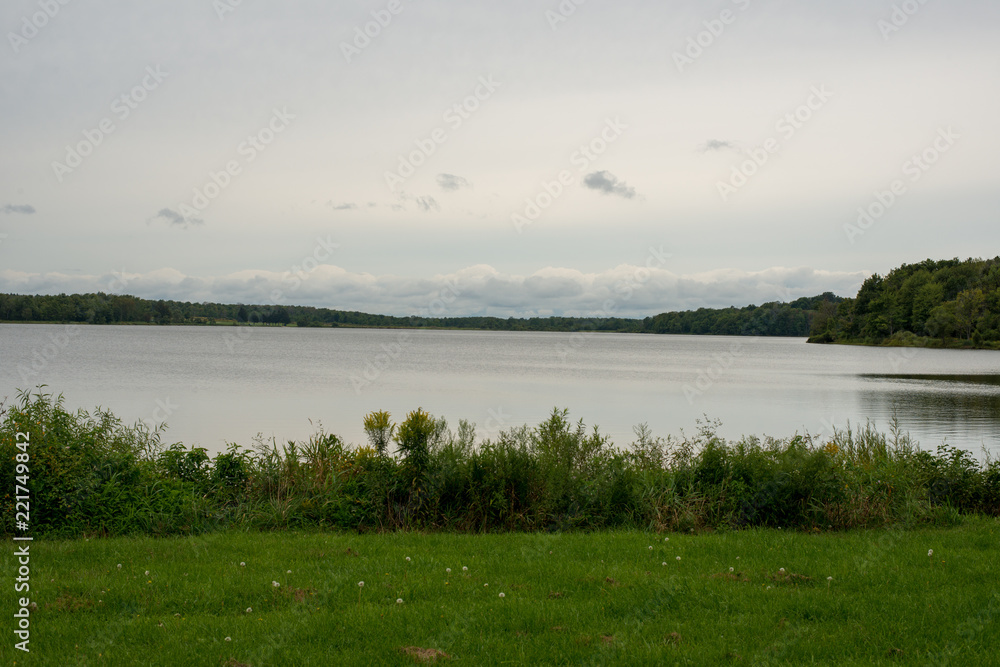View of Howard Eaton reservoir from the lakeshore, cloudy sky