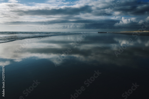 Reflection on the wet sand