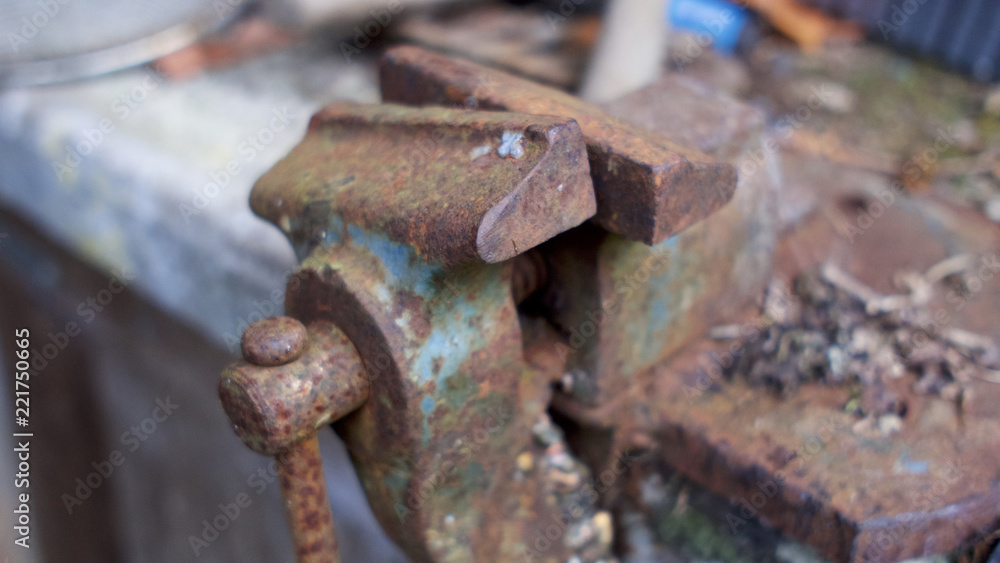 Rusted vice in an on a workshop bench