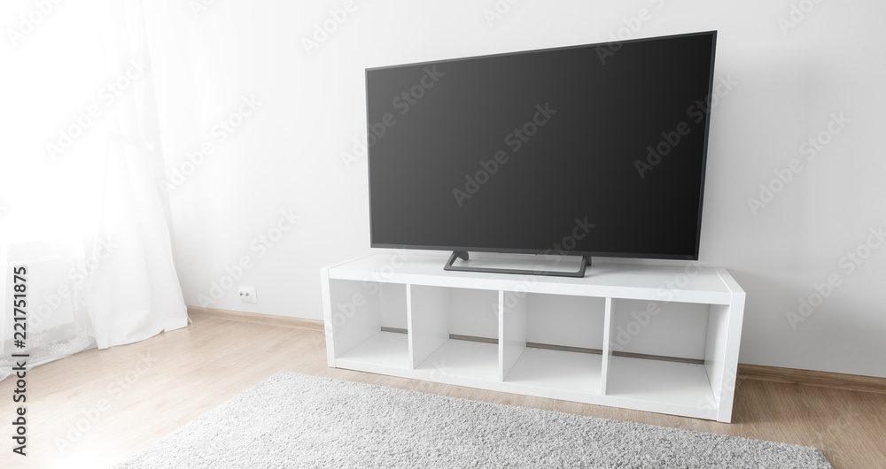 Lcd tv on white shef at modern room interior Lcd tv on white shef at modern room interior