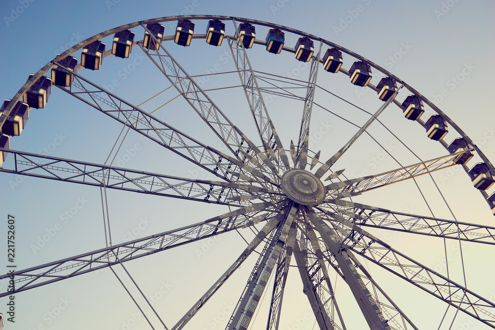 ferris wheel on background of blue sky