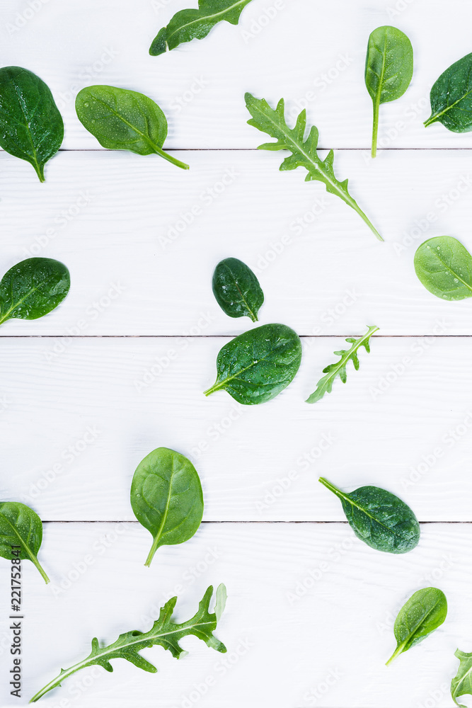 Top view of baby spinach and arugula leaves Top view of baby spinach and arugula leaves