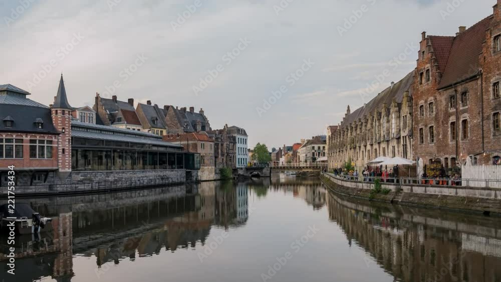 Pan motion timelapse video of the beautiful cityscape and Leie river from afternoon to sunset at Ghent, Belgium Pan motion timelapse video of the beautiful cityscape and Leie river from afternoon to sunset at Ghent, Belgium