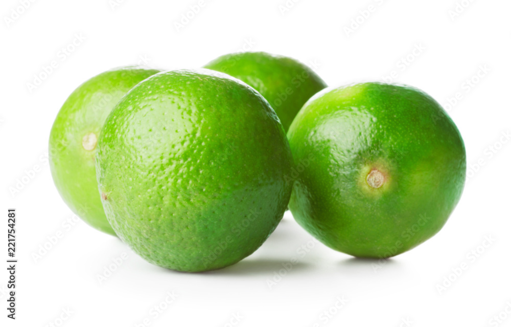 heap of fresh ripe limes isolated on white background heap of fresh ripe limes isolated on white background
