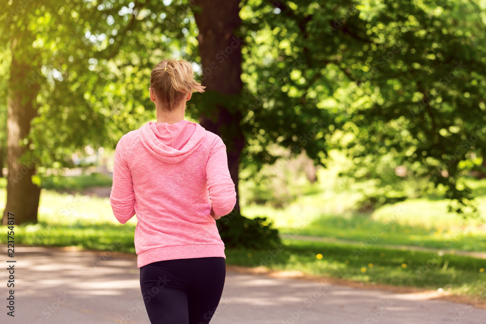 Fitness woman training and jogging in summer park Fitness woman training and jogging in summer park