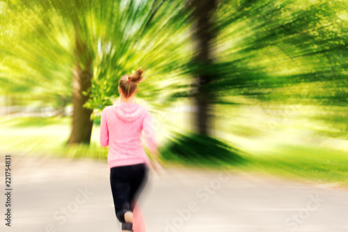 Fitness woman training and jogging in summer park © photopixel