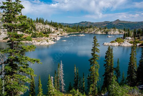 Blue Lake Mary surrounded by trees and clouds © The Speedy Butterfly