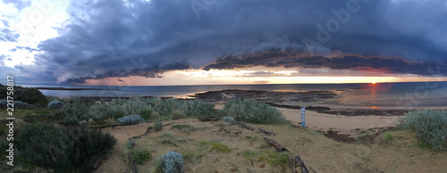 Sunset with storm clouds over ocean, at Ricketts Poont, Port Phillip Bay, Melbourne Australia photo