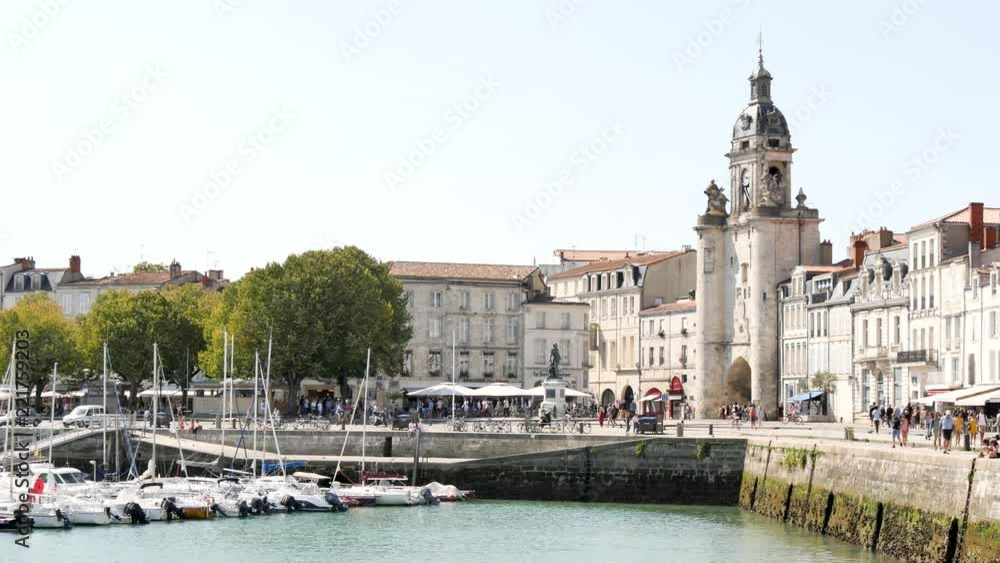 City centre of La rochelle, a seaport on the Atlantic coast in western France. It's a street near the old port. Filmed during the summer. There is boats in the old port of the town. City centre of La rochelle, a seaport on the Atlantic coast in western France. It's a street near the old port. Filmed during the summer. There is boats in the old port of the town.