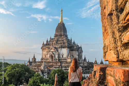 Woman looking at a pagoda in Bagan  Myanmar