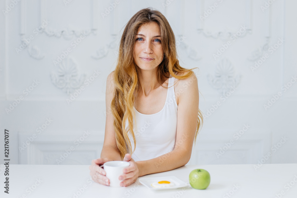 Young beautiful woman having breakfast in bed Young beautiful woman having breakfast in bed