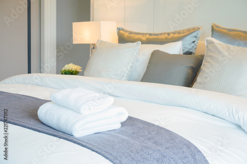 Clean towel on bed in modern interior bedroom