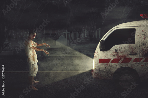фотографія Creepy zombie man attacking an ambulance car