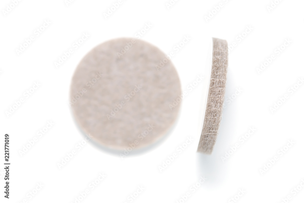 An innovation product for home appliance,top view..Closeup thickness of self adhesive pads for household furnitures preventing floor surface from scratching isolated on white background.. An innovation product for home appliance,top view..Closeup thickness of self adhesive pads for household furnitures preventing floor surface from scratching isolated on white background..