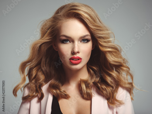 Beautiful young blond woman with sexy red lips.