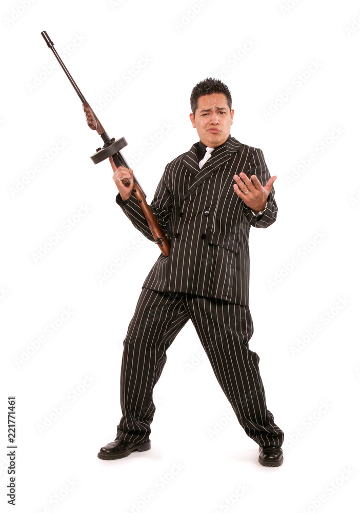 A 1940's styled adult male mafia gangster character wearing a black seersucker suit and holding a machine gun. A 1940's styled adult male mafia gangster character wearing a black seersucker suit and holding a machine gun.