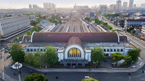 Jakarta Kota Train Station with Jakarta cityscape photo