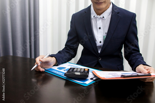 Businessman working with documents in the office photo