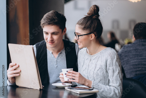 Guy and girl at a meeting in a cafe