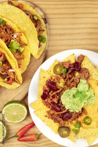 Overhead photo of Mexican tacos and nachos with copy space