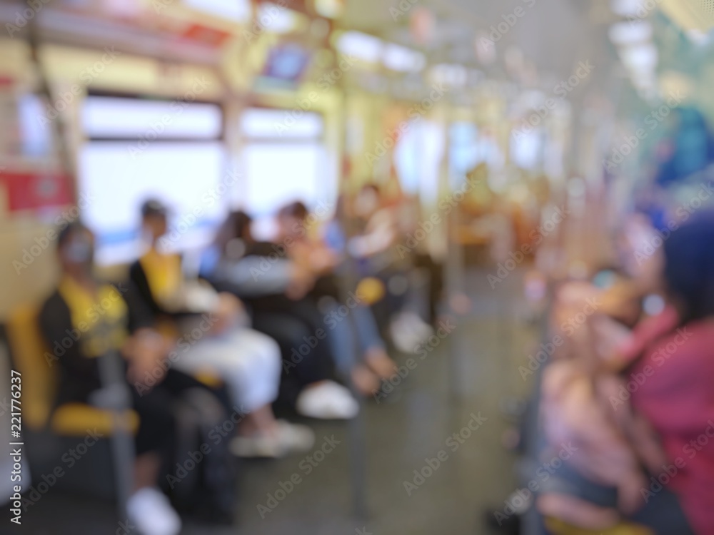 Blurred image of city people lifestyle background, inside the train. passenger sitting in underground waiting to go at work. Busy moment of persons in cab. Transport concept and technology addicted. Blurred image of city people lifestyle background, inside the train. passenger sitting in underground waiting to go at work. Busy moment of persons in cab. Transport concept and technology addicted.