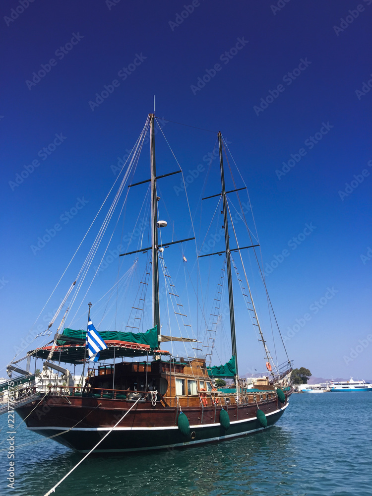 Greek antique style sailboat docking in the port
