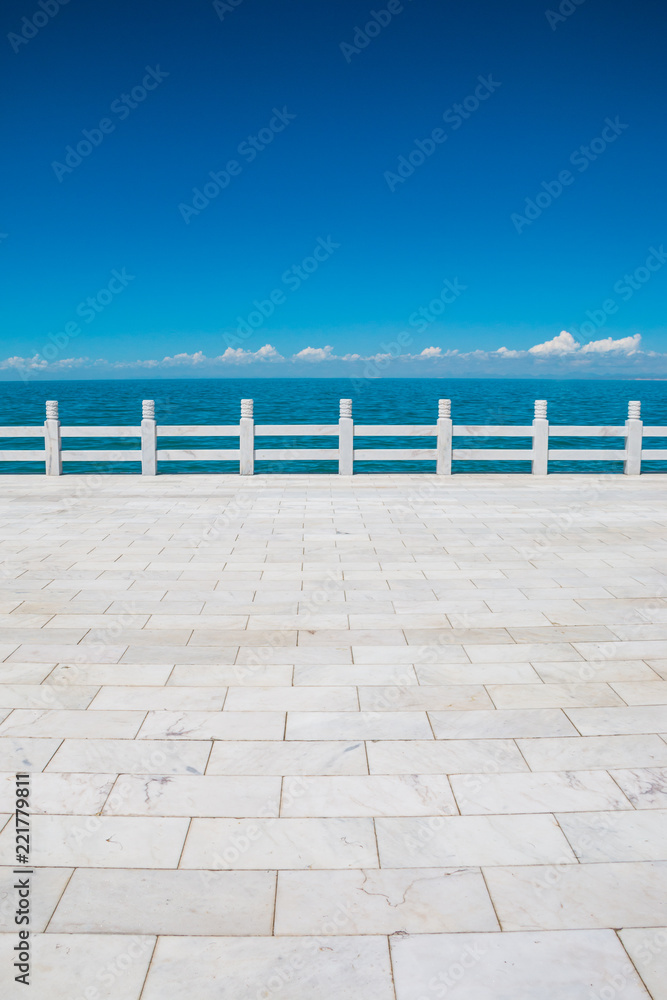 Sidewalk ground and Qinghai Lake, China