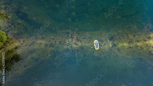 Yellow boat at the surface of the lake