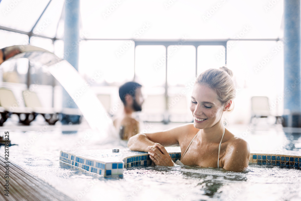 Portrait of beautiful woman relaxing in swimming pool - obrazy, fototapety, plakaty 