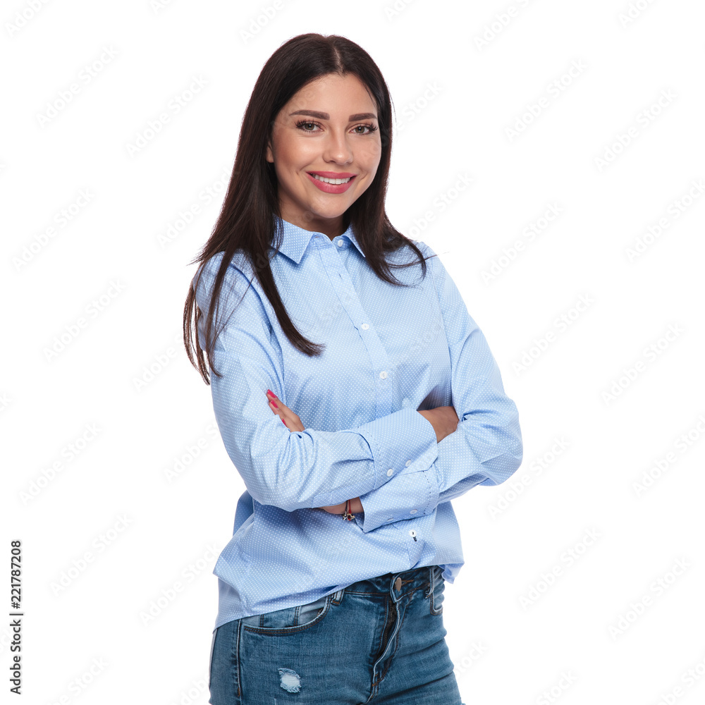 portrait of smiling brunette woman standing with arms crossed portrait of smiling brunette woman standing with arms crossed