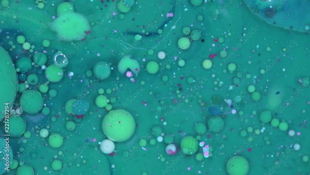 Abstract texture, mixing and movement of multicolored paint in water, slow motion. Abstract texture, mixing and movement of multicolored paint in water, slow motion.