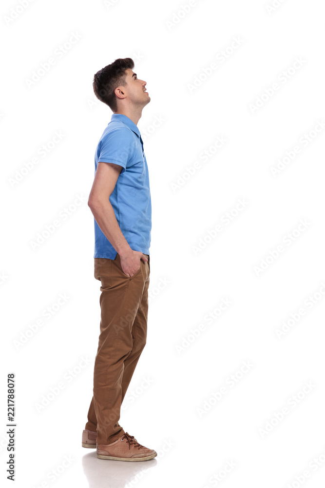 side view of a casual man looking up side view of a casual man looking up