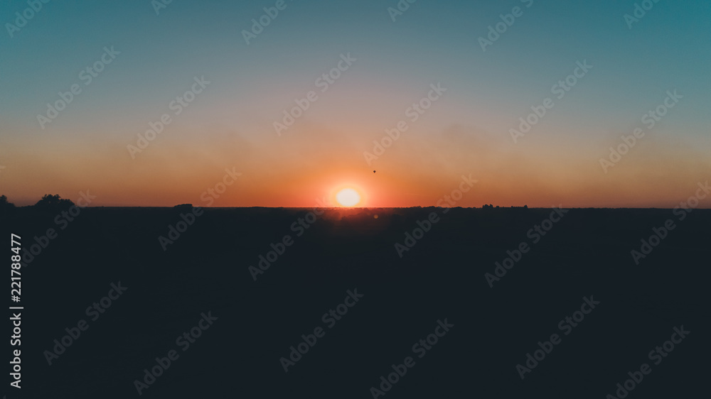 Aerial view of the sunset. A balloon against the sunset. Sky. Ukraine.