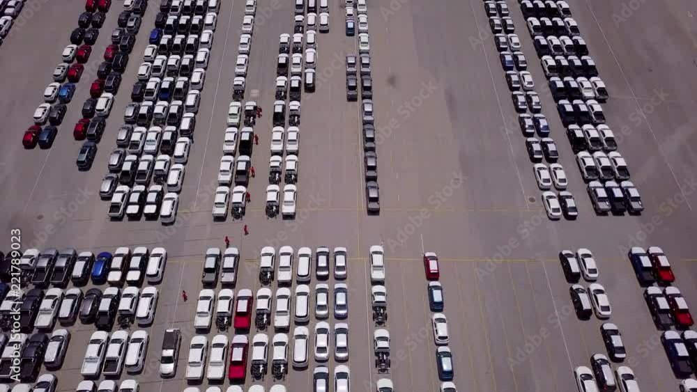 Aerial view of logistics concept commercial vehicles, cars and pickup trucks waiting to be load on to a roll-on/roll-off car carrier ship at Laem Chabang dockyard in Chonburi Province, Thailand Aerial view of logistics concept commercial vehicles, cars and pickup trucks waiting to be load on to a roll-on/roll-off car carrier ship at Laem Chabang dockyard in Chonburi Province, Thailand