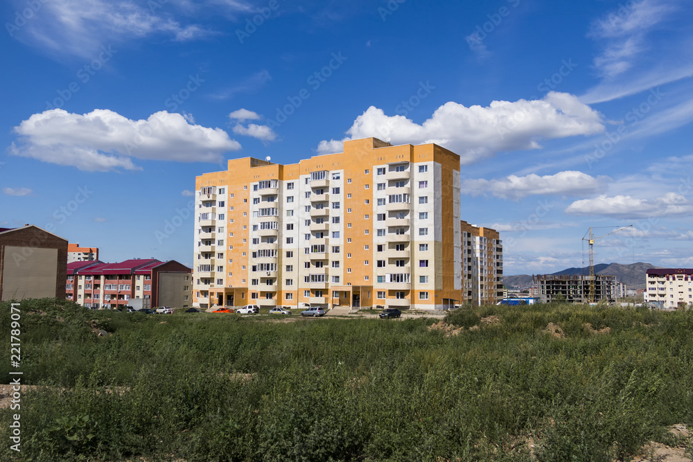 New apartment buildings. Kazakhstan (Ust-Kamenogorsk). New residential area. Building under construction. Bright. Modern architecture
