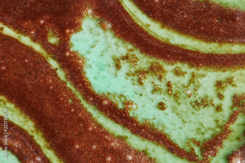 Close up of abstract background from melted chocolate and mint sorbet.