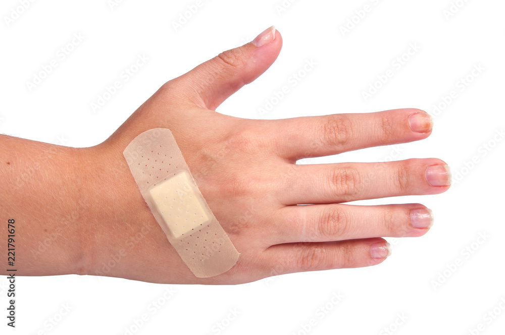 Naklejka premium medical plaster or patch on hand isolated on the white